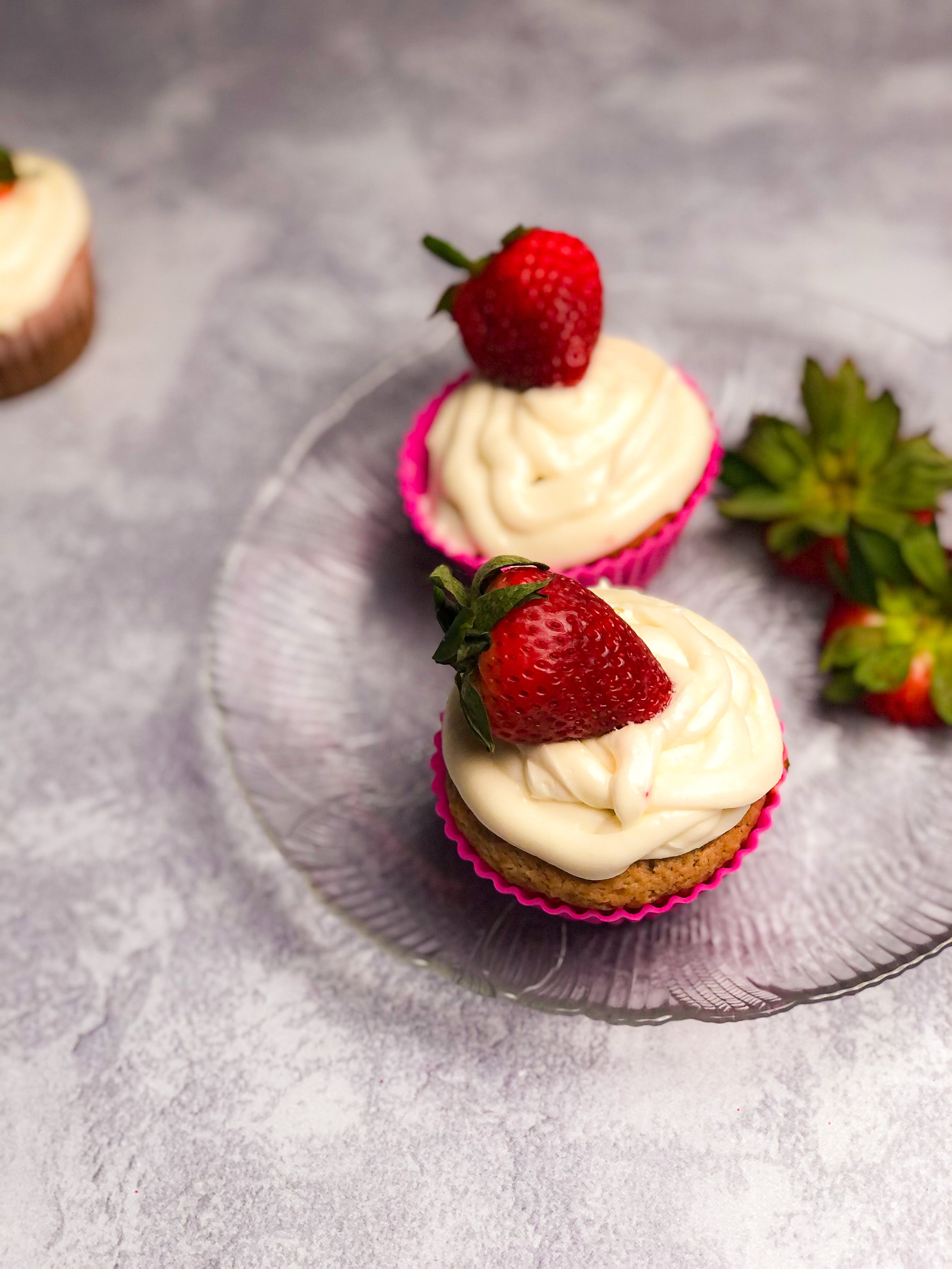 Homemade Strawberry Cupcakes with strawberries on top